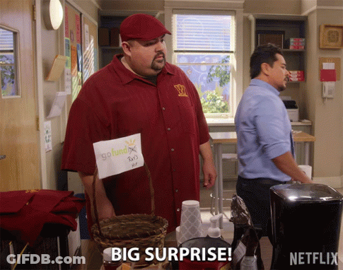 A Man In A Red Shirt Is Holding A Sign That Says Go Fund X GIF