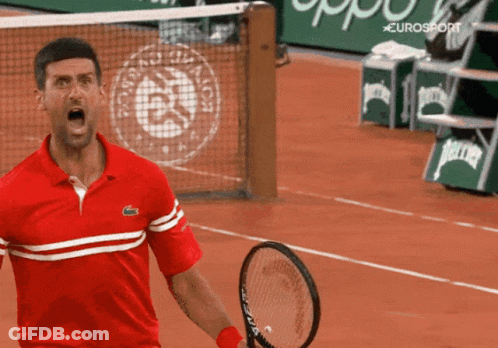 A Man In A Red Shirt Is Holding A Tennis Racquet In Front Of A Eurosport Ad GIF