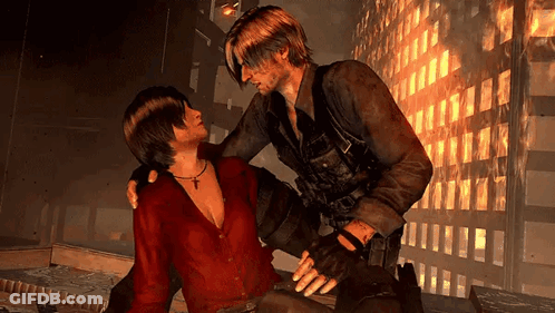 Man In Red Shirt Holding Another Man's Arm GIF
