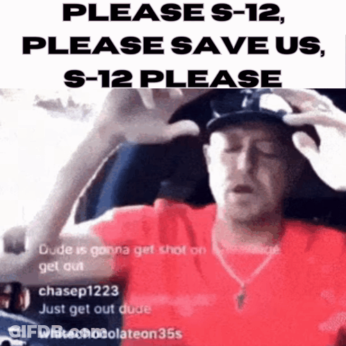 A Man In A Red Shirt Is Holding His Head And Asking For Help GIF