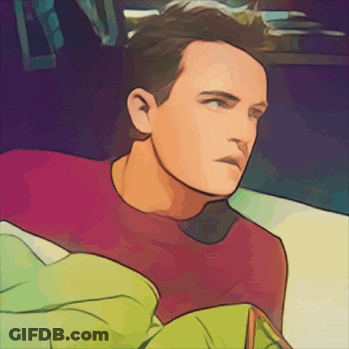 A Man In A Red Shirt Is Laying In Bed GIF