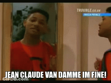 A Man In A Red Shirt Is Looking At Himself In A Mirror And Saying Jean Claude Van Damme Im Fine ! GIF