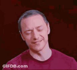 A Man In A Red Shirt Is Making A Face With His Eyes Closed . GIF