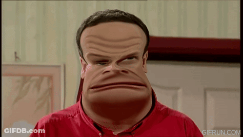 A Man In A Red Shirt Is Making A Funny Face And The Website Gifrun.com Is Visible In The Corner GIF