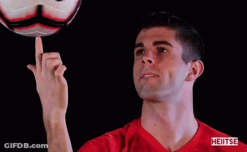 A Man In A Red Shirt Is Pointing At A Soccer Ball With The Word Heiiiise On The Bottom GIF