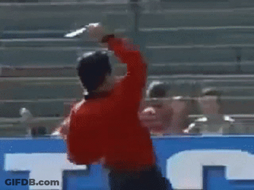 A Man In A Red Shirt Is Running On A Soccer Field In Front Of A Sign That Says Anta GIF