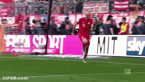A Man In A Red Shirt Is Running On A Soccer Field In Front Of A Sky Ad GIF