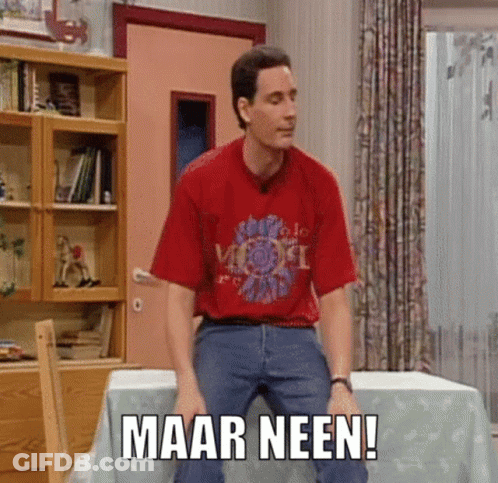 A Man In A Red Shirt Is Sitting At A Table With The Words Maar Neen Written On The Table Cloth GIF