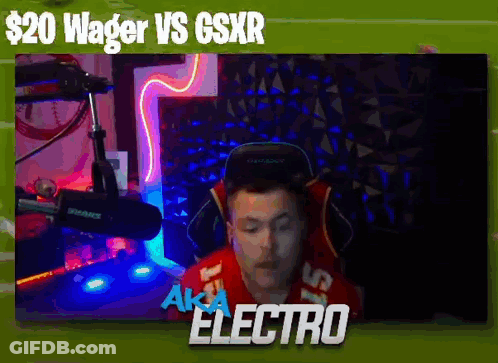 A Man In A Red Shirt Is Sitting In Front Of A Microphone With The Words Wager Vs Gsxr Above Him . GIF
