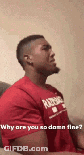 A Man In A Red Shirt Is Sitting On A Couch And Asking Why Are You So Damn Fine . GIF