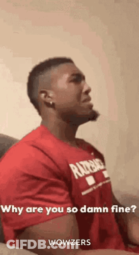 A Man In A Red Shirt Is Sitting On A Couch And Asking Why Are You So Damn Fine . GIF