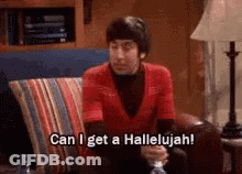 A Man In A Red Shirt Is Sitting On A Couch And Saying Can I Get A Hallelujah ! GIF
