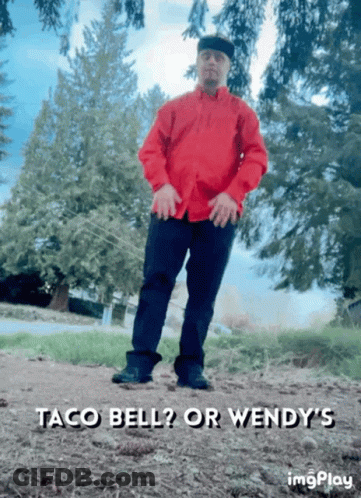 A Man In A Red Shirt Is Standing In A Field With The Words Taco Bell Or Wendy 'S Written Below Him GIF