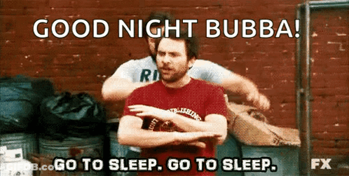 A Man In A Red Shirt Is Standing In Front Of A Brick Wall With A Caption That Says Good Night Bubba . GIF