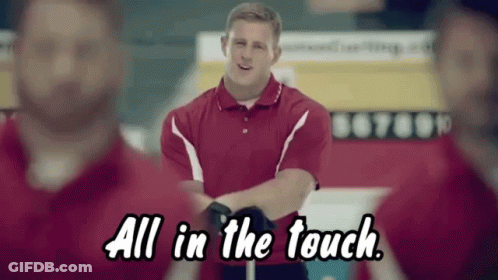 A Man In A Red Shirt Is Standing In Front Of A Group Of Men And Says All In The Touch GIF