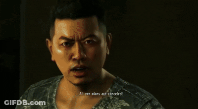 A Man In A Red Shirt Is Standing Next To Another Man In A Black Shirt GIF