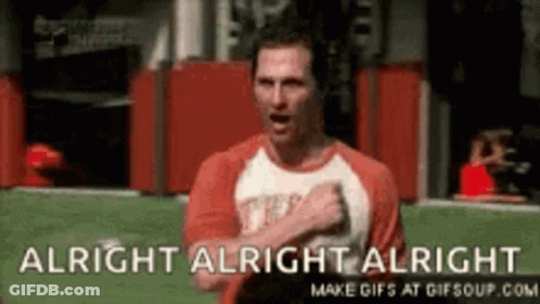 A Man In A Red Shirt Is Standing On A Field With His Hands On His Chest And The Words `` Alright Alright Alright '' . GIF