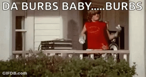 A Man In A Red Shirt Is Standing On A Porch With A Record Player . GIF
