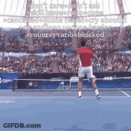 A Man In A Red Shirt Is Swinging A Tennis Racket On A Tennis Court GIF