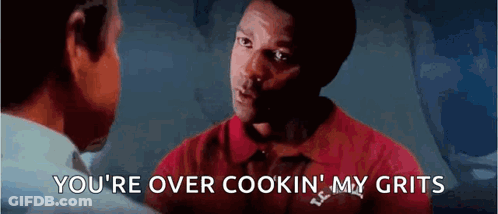 A Man In A Red Shirt Is Talking To Another Man And Says You 'Re Over Cookin My Grits . GIF