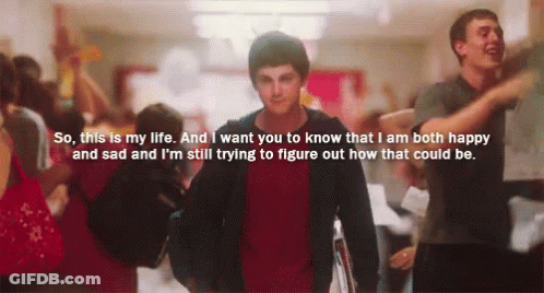 A Man In A Red Shirt Is Walking Down A Hallway With A Quote On The Bottom GIF