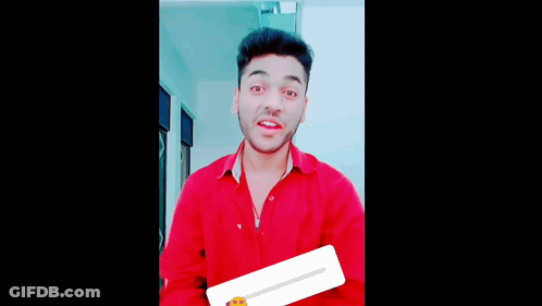 A Man In A Red Shirt Making A Funny Face GIF