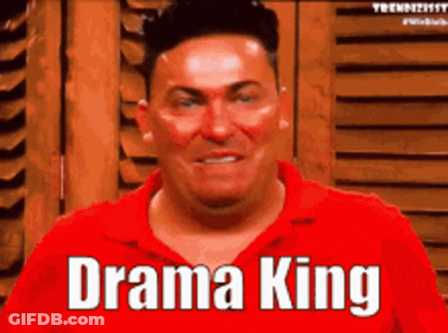 A Man In A Red Shirt Says " Drama King " On His Face GIF