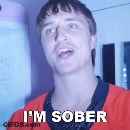 A Man In A Red Shirt Says " I 'M Sober " In White Letters GIF