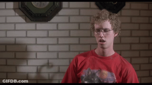 A Man In A Red Shirt Stands In Front Of A Brick Wall And Says " Heck Yes I Did " GIF