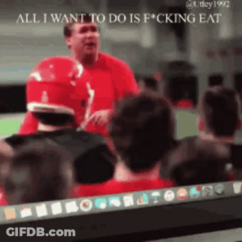 A Man In A Red Shirt Stands In Front Of A Group Of People And Says All I Want To Do Is Fucking Eat GIF