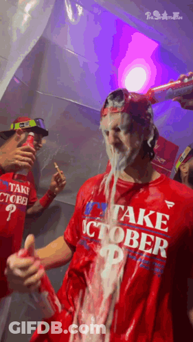 A Man In A Red Shirt That Says Take October P GIF