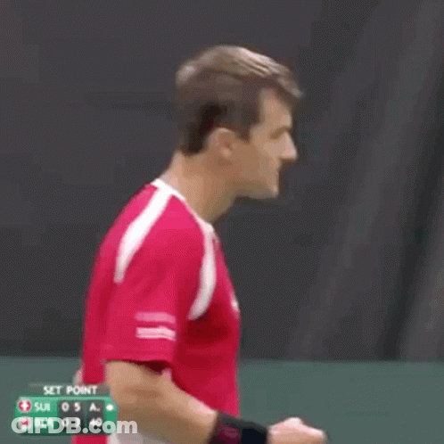 A Man In A Red Shirt With A Swiss Cross On It Is Shouting . GIF