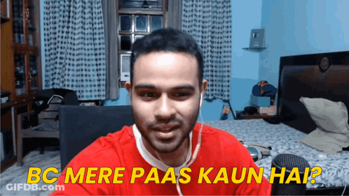A Man In A Red Shirt With Ear Buds Is Asking Bc Mere Paas Kaun Hai GIF