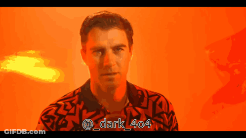 A Man In A Red Shirt With The Hashtag Dark 404 On The Bottom GIF