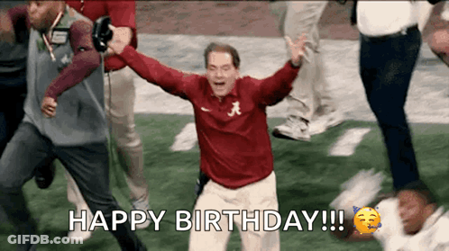 A Man In A Red Shirt With The Letter A On It Celebrates On A Football Field . GIF