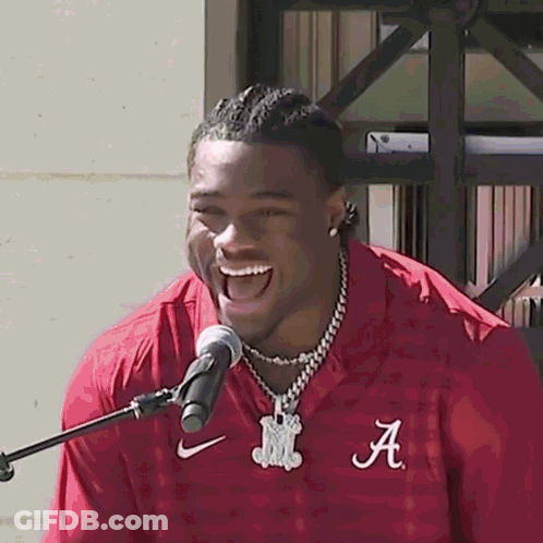 A Man In A Red Shirt With The Letter A On It GIF