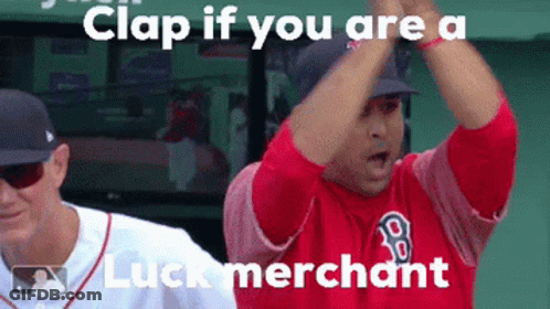 A Man In A Red Shirt With The Letter B On It Is Clapping GIF