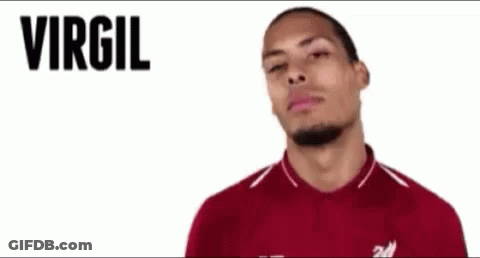 A Man In A Red Shirt With The Name Virgil Van Dijk Written On The Bottom GIF