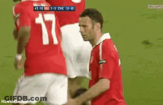 A Man In A Red Shirt With The Number 17 On His Back GIF