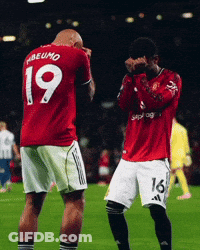 A Man In A Red Shirt With The Number 19 On The Back GIF