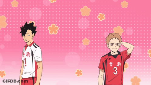 A Man In A Red Shirt With The Number 3 On It Stands Next To Another Man GIF