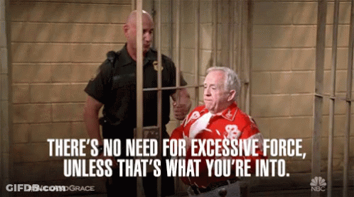 A Man In A Red Shirt With The Number 8 On It Behind Bars GIF