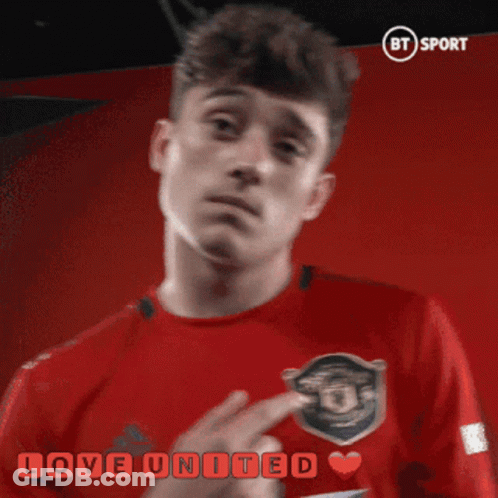 A Man In A Red Shirt With The Words Love United Written On It GIF