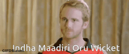 A Man In A Red Shirt With The Words ' Ndha Madiri Oru Wicket ' On The Bottom GIF