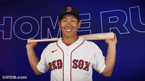 A Man In A Red Sox Jersey Is Holding A Baseball Bat Over His Shoulder GIF