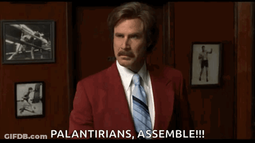 A Man In A Red Suit And Tie Is Saying " Palantirians Assemble !!! " GIF