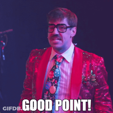 A Man In A Red Suit And Tie Says Good Point GIF