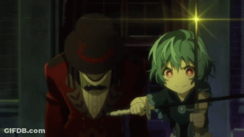 A Man In A Red Suit And Top Hat Stands Next To A Girl With Green Hair GIF