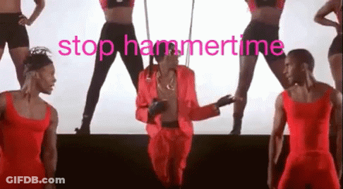 A Man In A Red Suit Is Dancing On A Stage With A Group Of Dancers Behind Him . GIF
