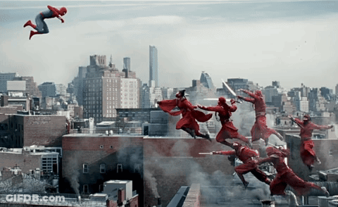 A Man In A Red Suit Is Flying Through The Air In Front Of A City GIF